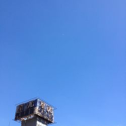 Low angle view of built structure against clear blue sky