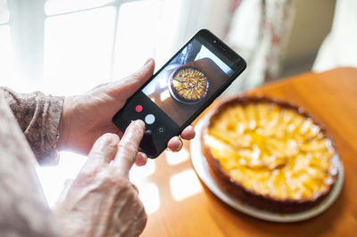 Close-up of hand holding smart phone
