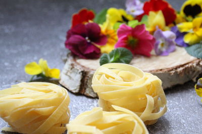 Close-up of yellow roses on table
