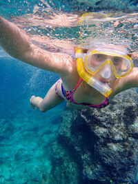 Girl swimming in sea