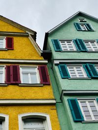 Low angle view of yellow building against sky