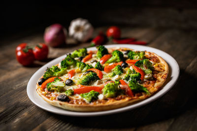 Close-up of pizza served on table