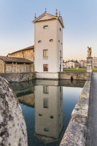 View of tower amidst buildings against sky