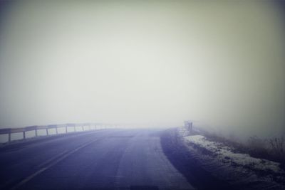 Empty road in foggy weather