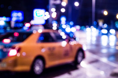 Defocused image of taxi at night