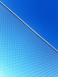 Low angle view of building against clear blue sky