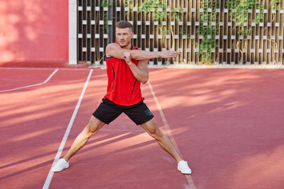 Full length of man playing soccer