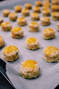 High angle view of mini scones on baking sheet