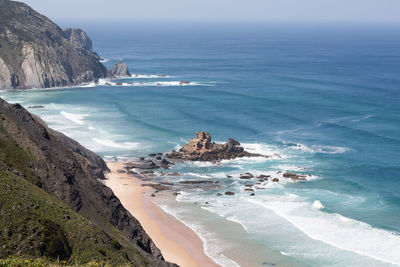 Scenic view of beach and sea at algarve