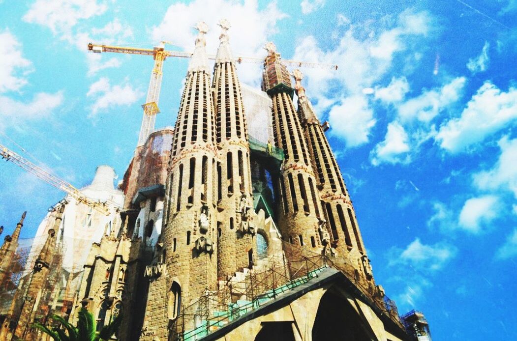 architecture, building exterior, religion, built structure, church, place of worship, low angle view, spirituality, sky, cathedral, cloud - sky, blue, cloud, day, outdoors, travel destinations, no people