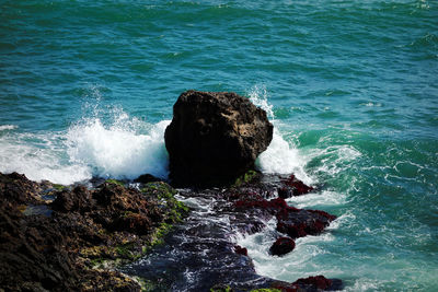 Sea waves splashing on rocks