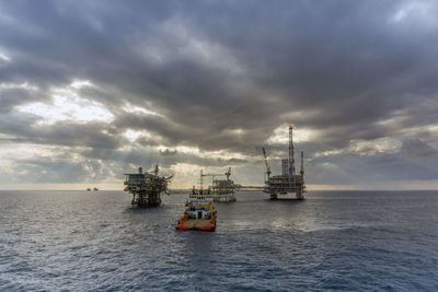 An anchor handling tug boat maneuvering while performing anchor deployment at offshore oil field