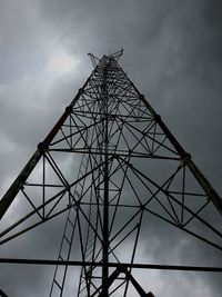 Low angle view of communications tower against sky