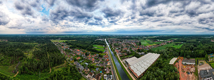 High angle view of townscape against cloudy sky