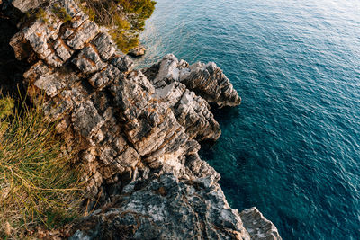 High angle view of rock formation in sea