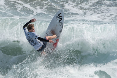 Man surfing in sea