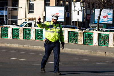 Full length of man standing on road