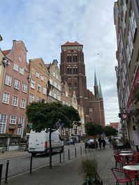 Buildings in city against sky