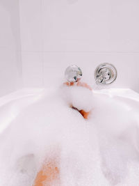 Woman bathing in the bubble bath