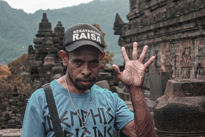 Portrait of man standing outdoors