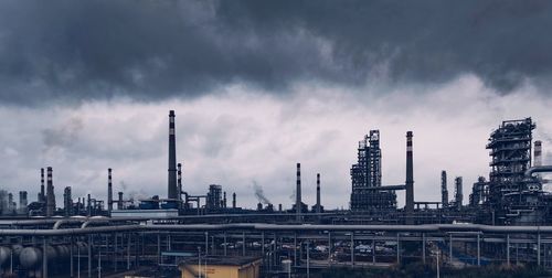 View of factory against cloudy sky