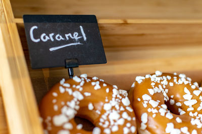 Close-up of caramel donuts for sale 