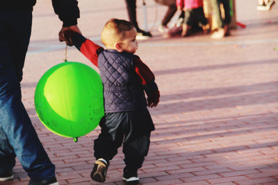 Rear view of children playing