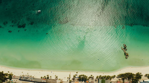 Aerial view of beach with houses by sea