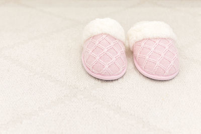 Close-up of shoes on pink board