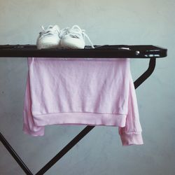 Shoes and t-shirt on drying rack