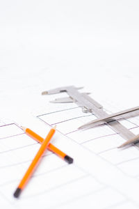 Close-up of pencil on white surface