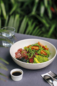Bowl of tuna poke with vegetables