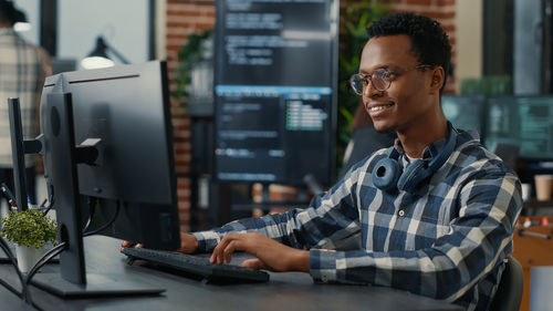 Smiling businessman working at office