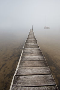 Pier over sea against sky