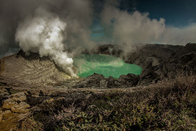 Smoke emitting from volcanic landscape