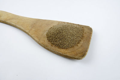 Close-up of bread over white background