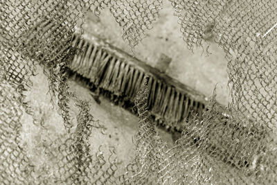 Close-up of rusty metal in cage