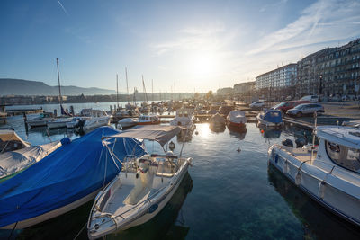 Boats moored at harbor