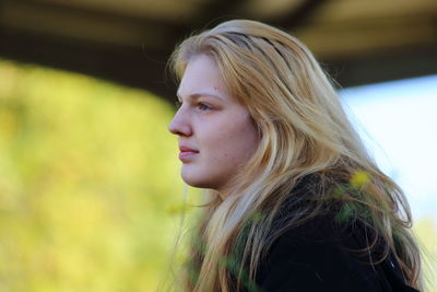 Young woman looking away outdoors