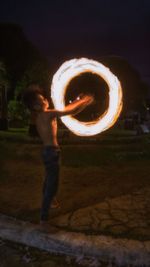 Blurred motion of people holding fire