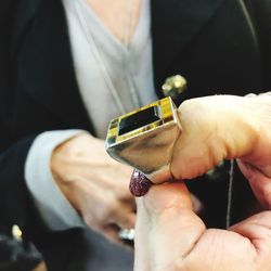 Close-up of man holding hands