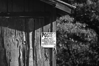 Information sign against trees