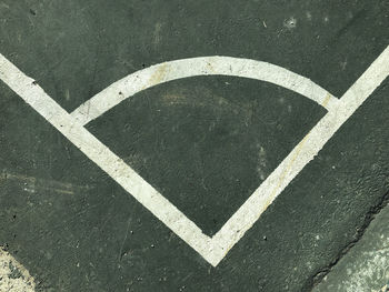 High angle view of arrow sign on road