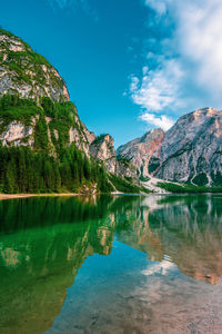 Scenic view of lake and mountains against sky