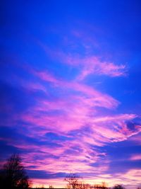 Low angle view of dramatic sky at sunset