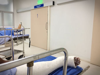 Low section of patients lying in hospital room