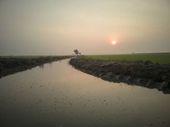 Scenic view of landscape against sky during sunset