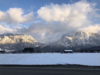 Scenic view of snowcapped mountains against sky