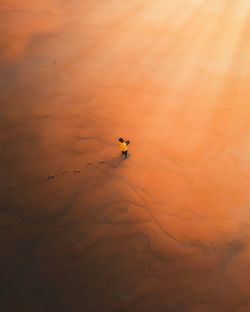 High angle view of sea against sky during sunset