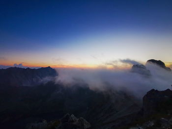 Scenic view of mountains against sky during sunset
